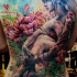 Beautiful illustrative style colored whole back tattoo of naked woman with flowers