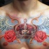 Schön aussehendes farbiges Brust Tattoo von großer Krone mit Flügeln und Blumen