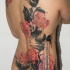 Beautiful looking colored whole back tattoo of beautiful flowers with lettering