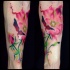 Beautiful looking illustrative style arm tattoo of flower