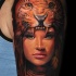 Beautiful painted natural looking shoulder tattoo of woman with leopard helmet