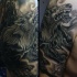 Big black and gray style colored shoulder tattoo of werewolf