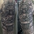 Großer schwarzer Dot Stil meditierender Buddha Tattoo auf der Schulter