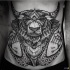 Big black ink stippling style mysterious looking belly tattoo of demonic goat