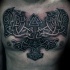 Big Celtic style chest tattoo of various symbols and knots