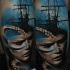 Big colored leg tattoo of big ship with woman face and octopus
