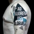 Big colored lettering tattoo on shoulder combined with geometrical figures