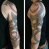 Big colored shoulder tattoo of ancient Celtic symbols and ornaments