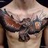 Big detailed beautiful looking chest tattoo of flying owl with old lighter