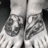 Pés de estilo grande ponto tatuagem de crânio animal com sol