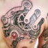 Big mechanism tattoo on chest