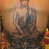 Tatuaje en la espalda, buda grande que medita