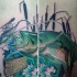 Tatuaje en el muslo, pez verde grande en totoral