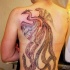 Big phoenix tattoo on whole back for women