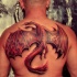 Tatuaggio impressionante sulla schiena il dragone rosso