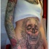 grande cranio con modelli nero tatuaggio su pancia