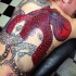 Tatuaje en la espalda, pulpo rojo grande inacabado