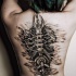 Biomechanical spine tattoo on back for girls