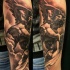Black and gray style arm tattoo of big stone angel statue