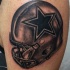 Black and gray style awesome looking shoulder tattoo of American football helmet