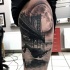 Black and gray style big thigh tattoo of woman falling from bridge