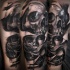 Black and gray style demonic woman portrait with skulls tattoo on shoulder