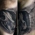 Black and gray style detailed biceps tattoo of human skull