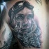Black and gray style detailed scapular tattoo of woman snowboarder