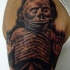 Black and gray style detailed shoulder tattoo of ancient sculpture