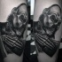 Black and gray style original looking leg tattoo of monster human skeleton