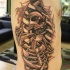 Black and gray style original looking side tattoo of human skeleton under bones