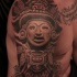 Black and gray style shoulder tattoo fo antic stone statue