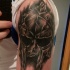 Black and gray style shoulder tattoo of gladiators helmet