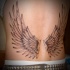 Black and gray style small typical designed angel wings tattoo on waist