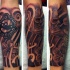 Black and gray style tattoo of ancient symbols and statues with flower