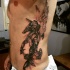 Black and gray style very detailed side tattoo of Egypt God warrior
