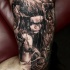 Black and grays style detailed arm tattoo of devils woman