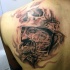 Black and grays tyle awesome looking scapular tattoo of creepy warrior