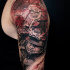 Black and red samurai tattoo on shoulder