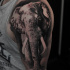 Black and whit elephant tattoo on shoulder