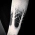 Black and white leafless trees tattoo with partly dotted work technique