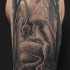Black and white shoulder tattoo of demonic werewolf with dark forest