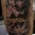 Black ink arm tattoo of Buddha statue with old city