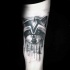 Black ink beautiful looking arm tattoo of raccoon face with forest