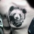 Black ink beautiful looking chest tattoo of lifelike panda bear
