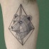 Black ink biceps tattoo of bear head with rhombus