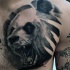 Black ink chest tattoo of roaring panda bear head