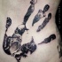 Black ink hand shaped tattoo of creepy monsters