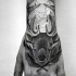 Black ink hand tattoo of deer head with leaves