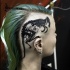 Black ink head tattoo of animal skull